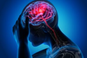 x-ray view of person with a traumatic brain injury (TBI) holding their head