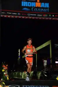 Dr. Evan Malone in running segment of Ironman triathlon