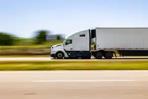 a semi truck on a rural road